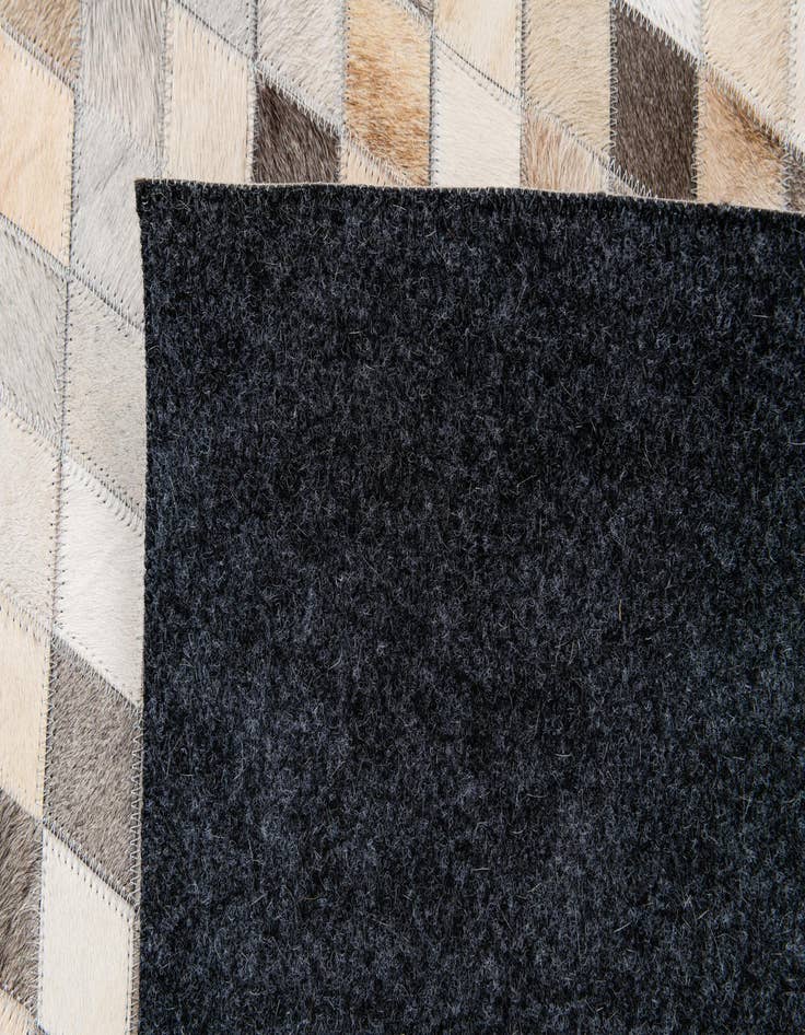 Detail image of  6' 7 x 9' 11 Cowhide Stocks Rug