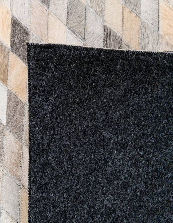 Detail image of  6' 8 x 9' 11 Cowhide Stocks Rug