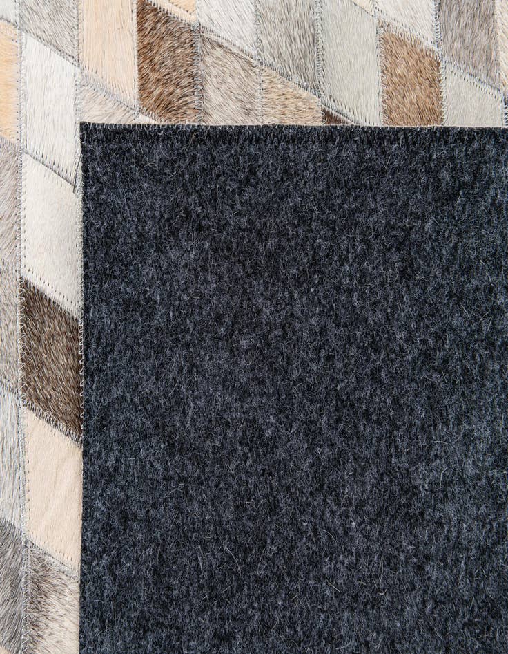 Detail image of  6' 8 x 9' 9 Cowhide Stocks Rug