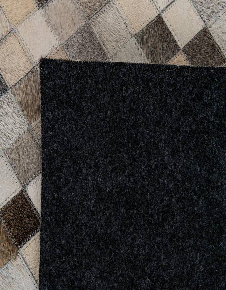 Detail image of  6' 7 x 9' 11 Cowhide Stocks Rug