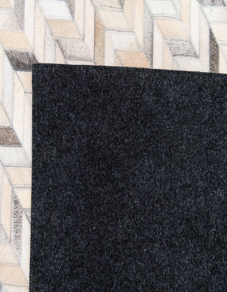 Detail image of  6' 8 x 9' 10 Cowhide Stocks Rug