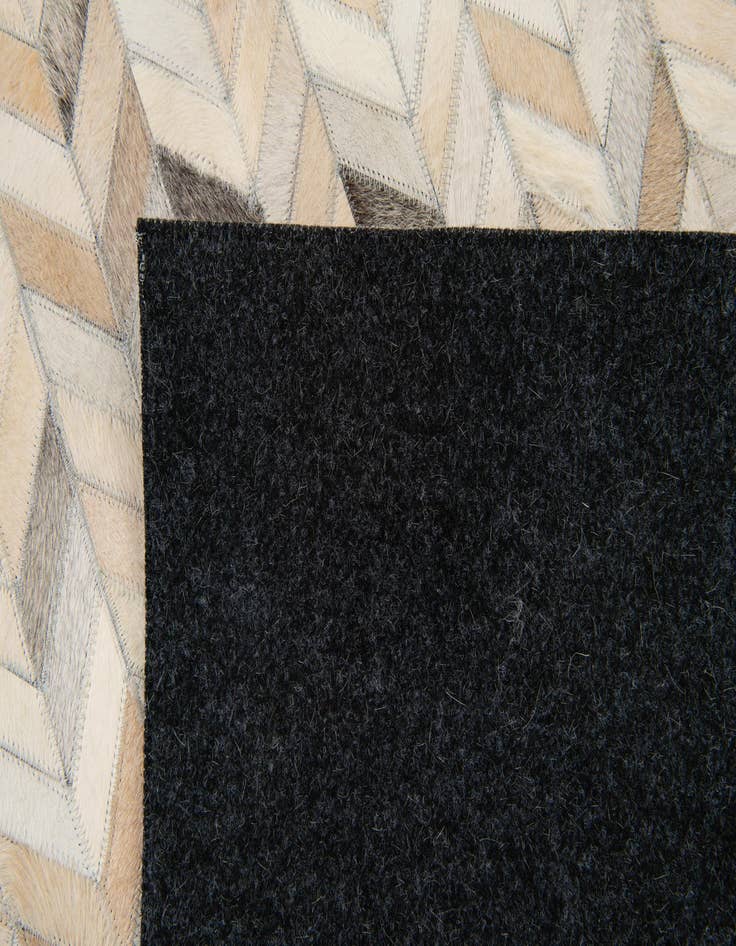 Detail image of  6' 8 x 9' 10 Cowhide Stocks Rug