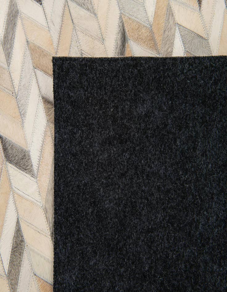 Detail image of  6' 8 x 9' 11 Cowhide Stocks Rug