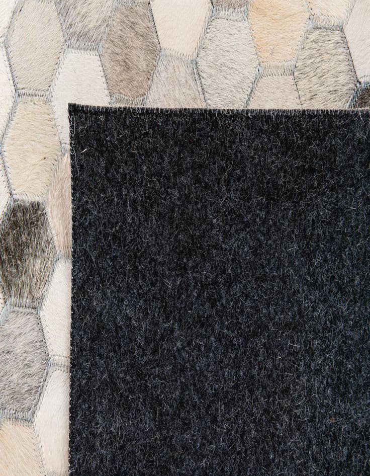 Detail image of  6' 7 x 10' 1 Cowhide Stocks Rug