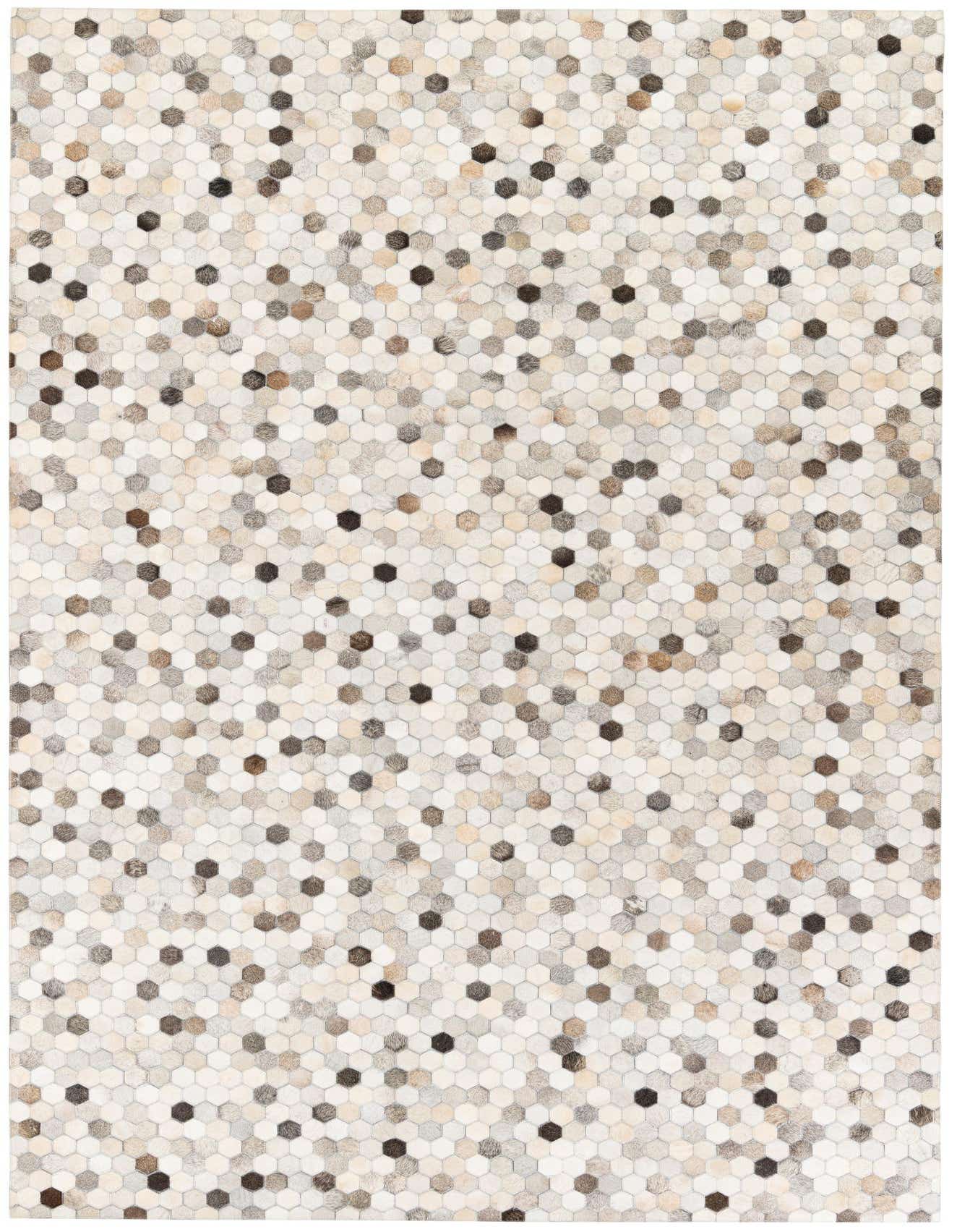 A 7x10 rectangular modern rug made from multi-colored cowhide and leather hexagons, perfect for a living room.