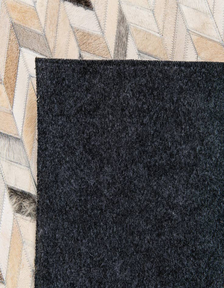 Detail image of  6' 8 x 9' 11 Cowhide Stocks Rug