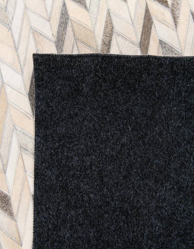 Detail image of  6' 7 x 9' 10 Cowhide Stocks Rug