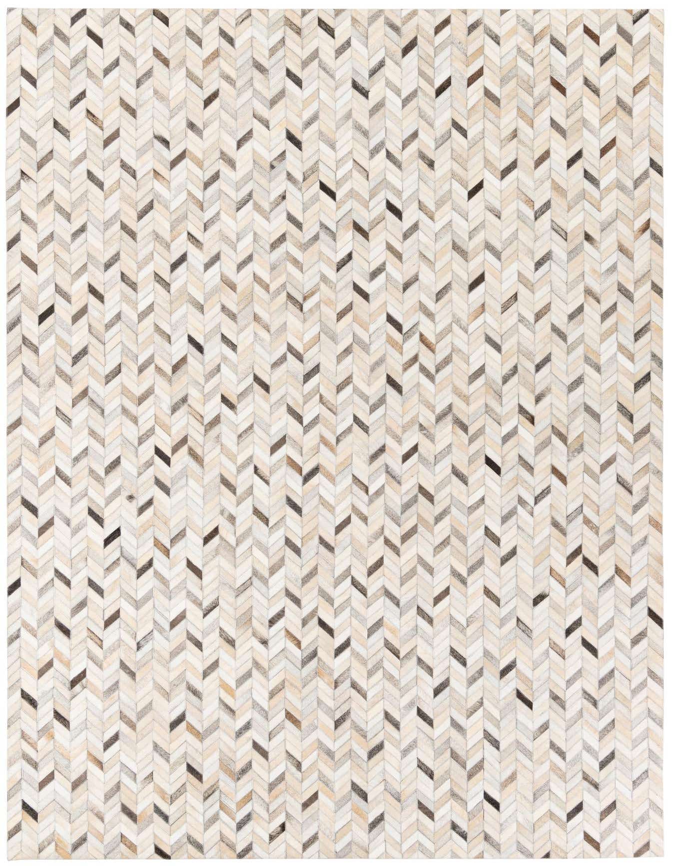 A rectangular 7x10 multi-colored cowhide rug featuring a modern chevron pattern in various shades of brown, beige, and white.