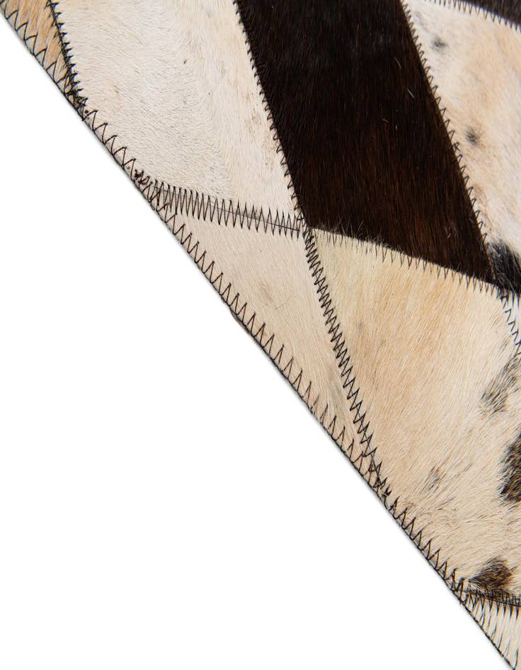 Detail image of  4' 8 x 6' 9 Cowhide Stocks Rug
