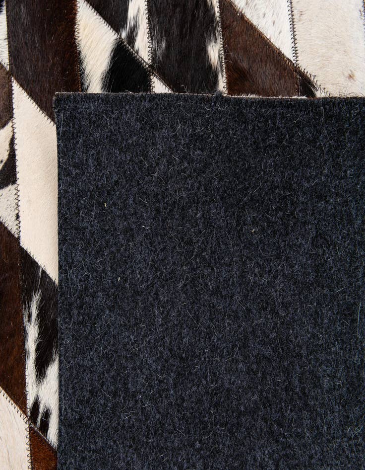 Detail image of  4' 8 x 6' 9 Cowhide Stocks Rug