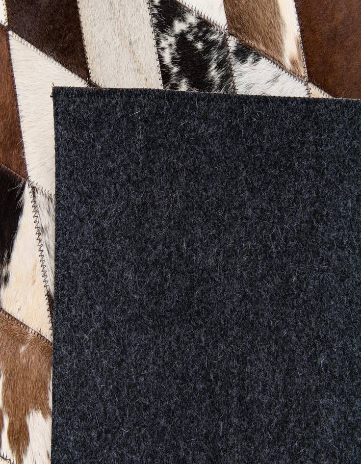 Detail image of  4' 8 x 6' 9 Cowhide Stocks Rug