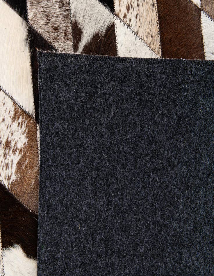 Detail image of  4' 8 x 6' 9 Cowhide Stocks Rug