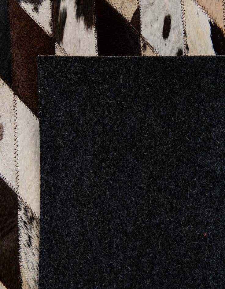 Detail image of  4' 8 x 6' 8 Cowhide Stocks Rug