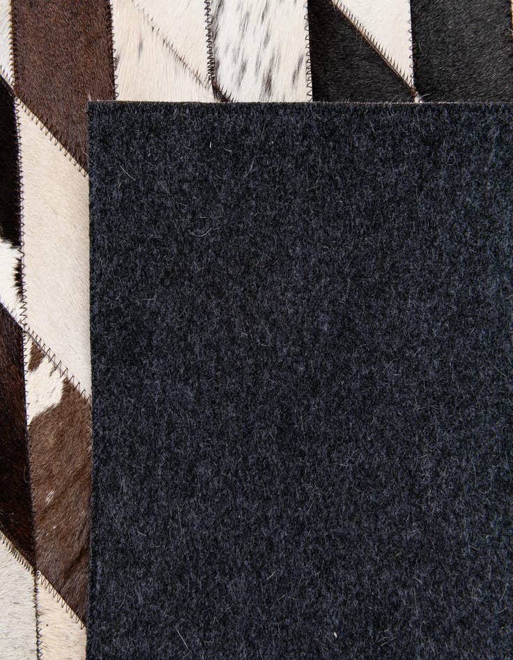Detail image of  4' 9 x 6' 9 Cowhide Stocks Rug