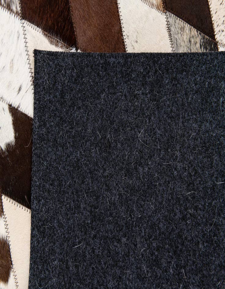 Detail image of  4' 9 x 6' 9 Cowhide Stocks Rug