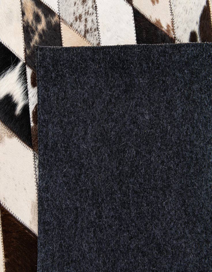 Detail image of  4' 8 x 6' 9 Cowhide Stocks Rug