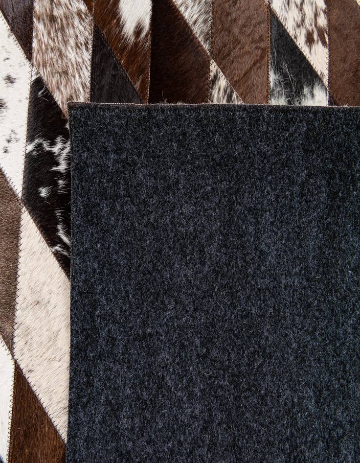 Detail image of  4' 8 x 6' 8 Cowhide Stocks Rug