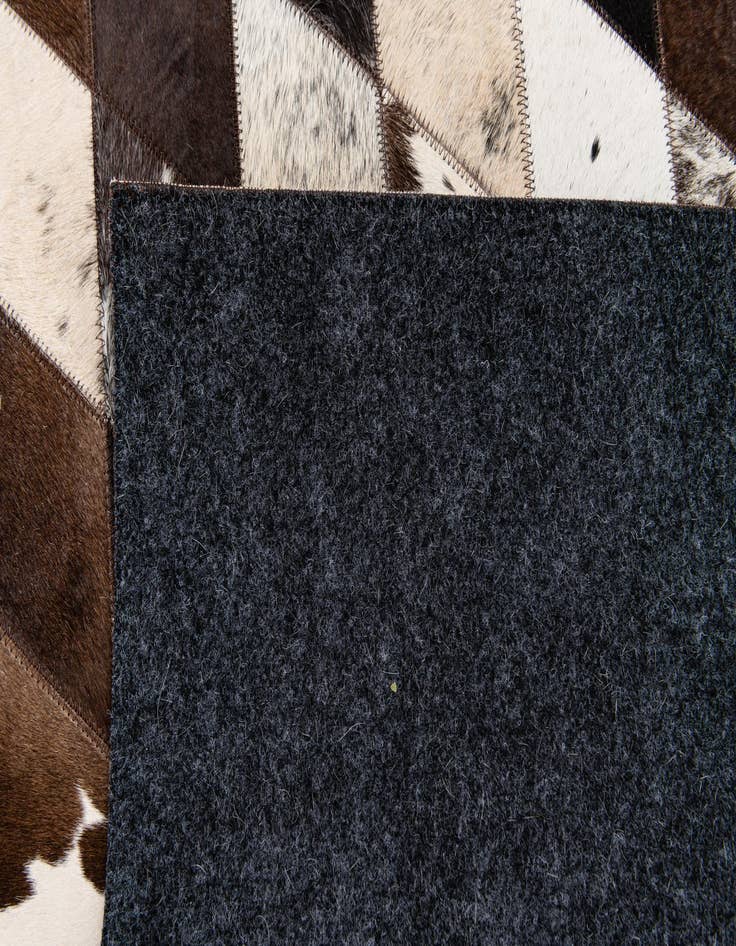 Detail image of  4' 8 x 6' 9 Cowhide Stocks Rug