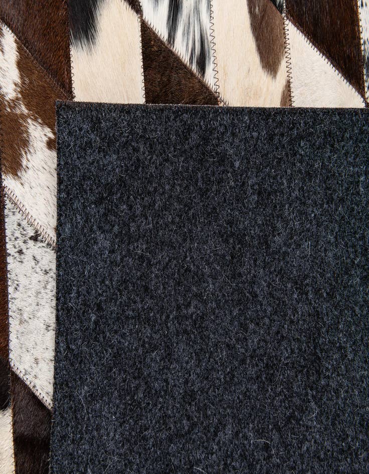 Detail image of  4' 8 x 6' 8 Cowhide Stocks Rug