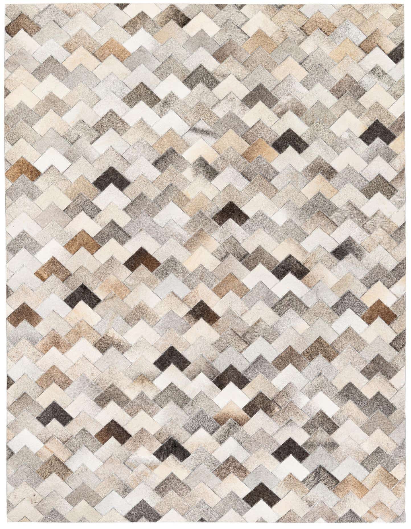 A rectangular 5x7 Cowhide Stocks rug featuring a modern chevron pattern in multi-colored natural cowhide and leather.