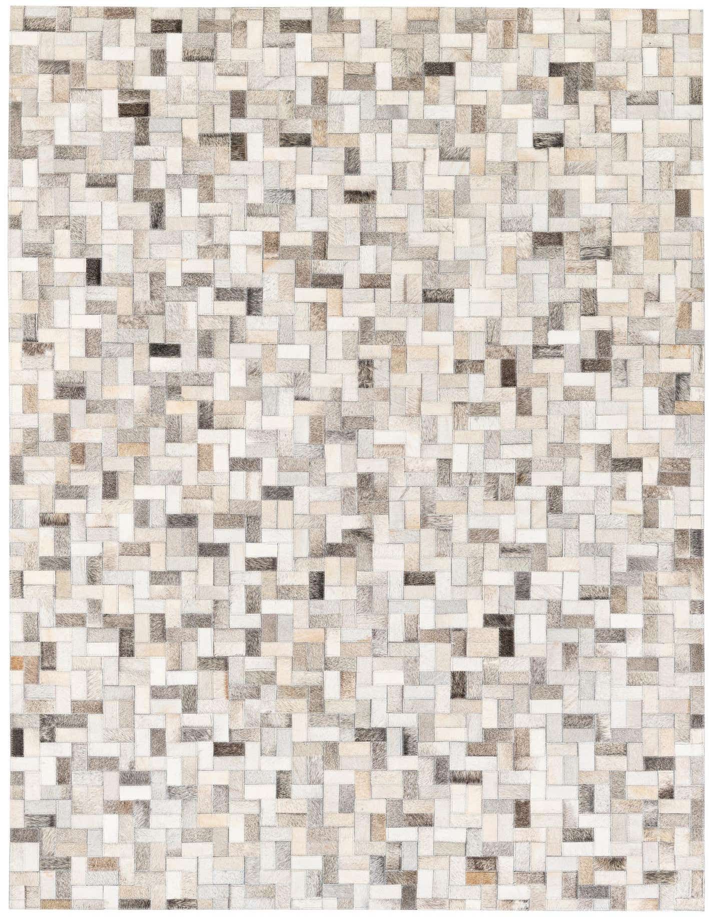 A 5x7 rectangular modern cowhide rug featuring a multi-colored patchwork design in various shades of grey, white, and brown.