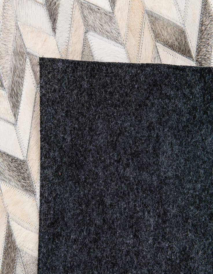 Detail image of  4' 7 x 6' 7 Cowhide Stocks Rug