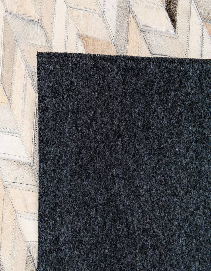 Detail image of  4' 7 x 6' 7 Cowhide Stocks Rug