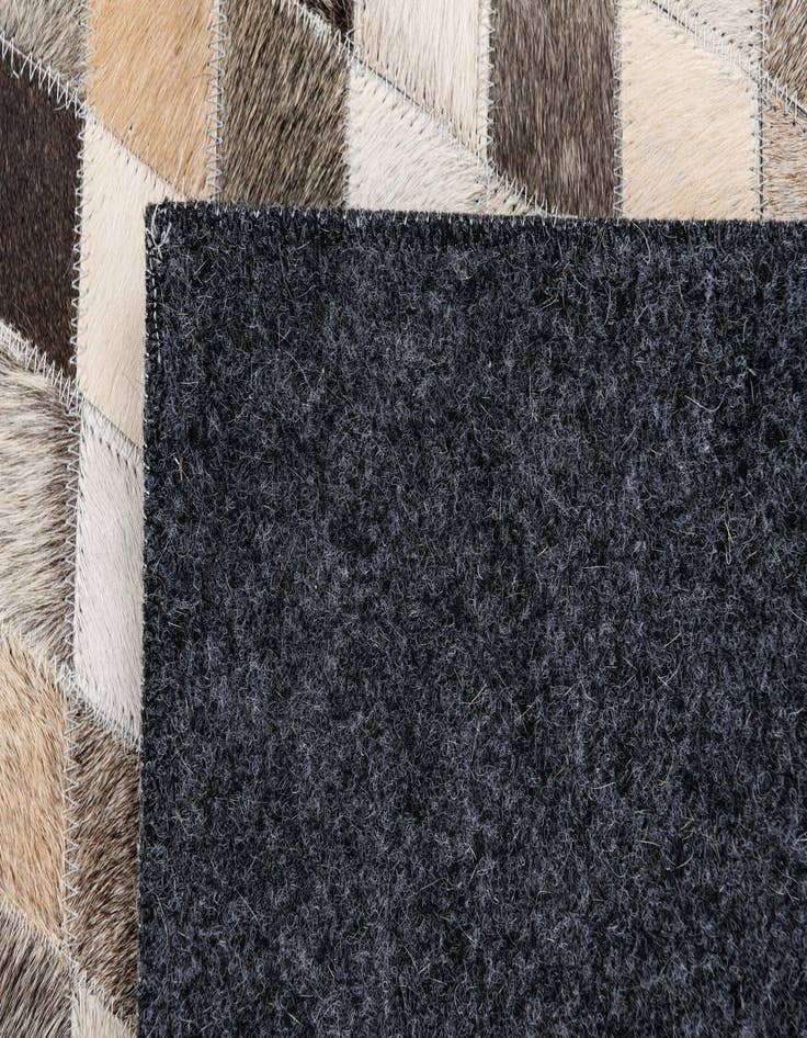 Detail image of  4' 7 x 6' 7 Cowhide Stocks Rug