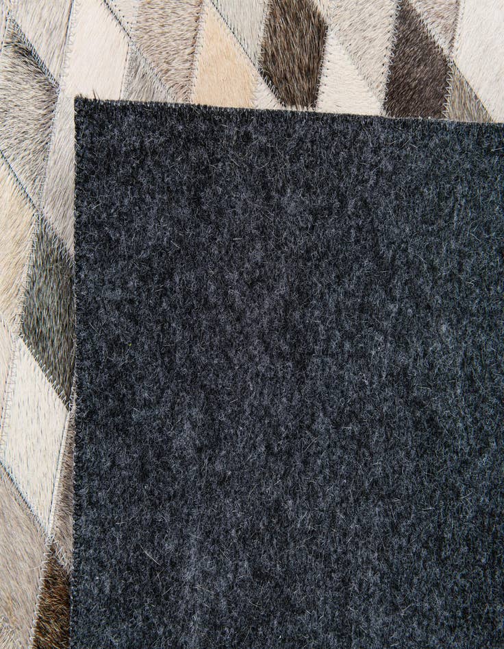 Detail image of  4' 7 x 6' 7 Cowhide Stocks Rug