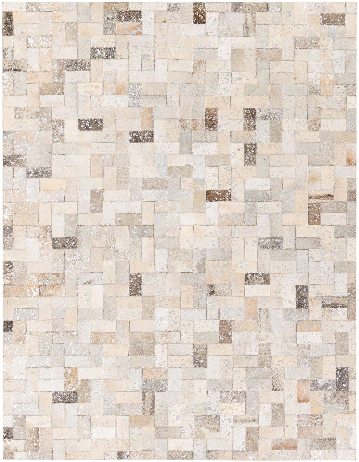 A 5x7 rectangular modern cowhide rug featuring a patchwork of multi-colored natural hide squares and rectangles in varying shades of white, beige, brown, and grey.