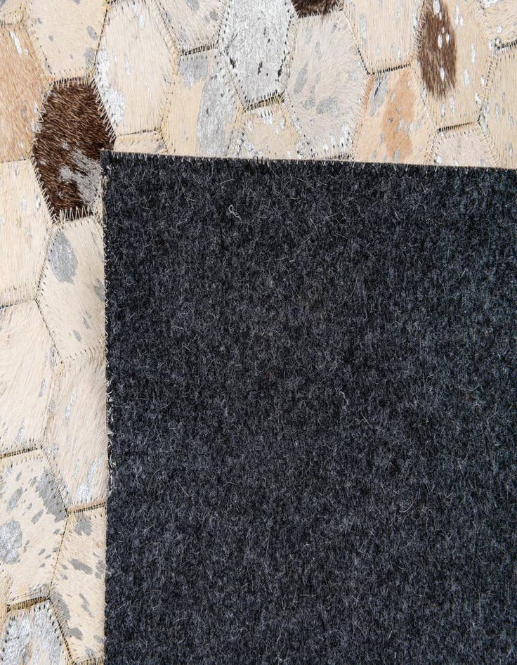 Detail image of  4' 7 x 6' 7 Cowhide Stocks Rug