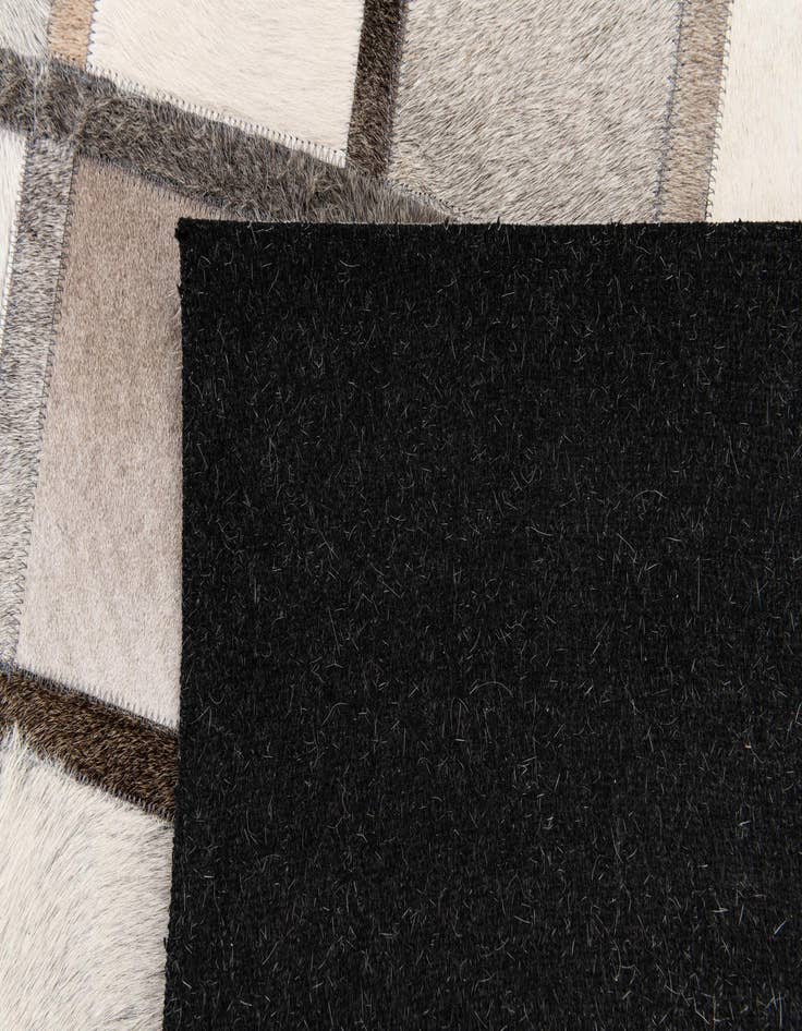 Detail image of  4' 1 x 6' 3 Cowhide Stocks Rug