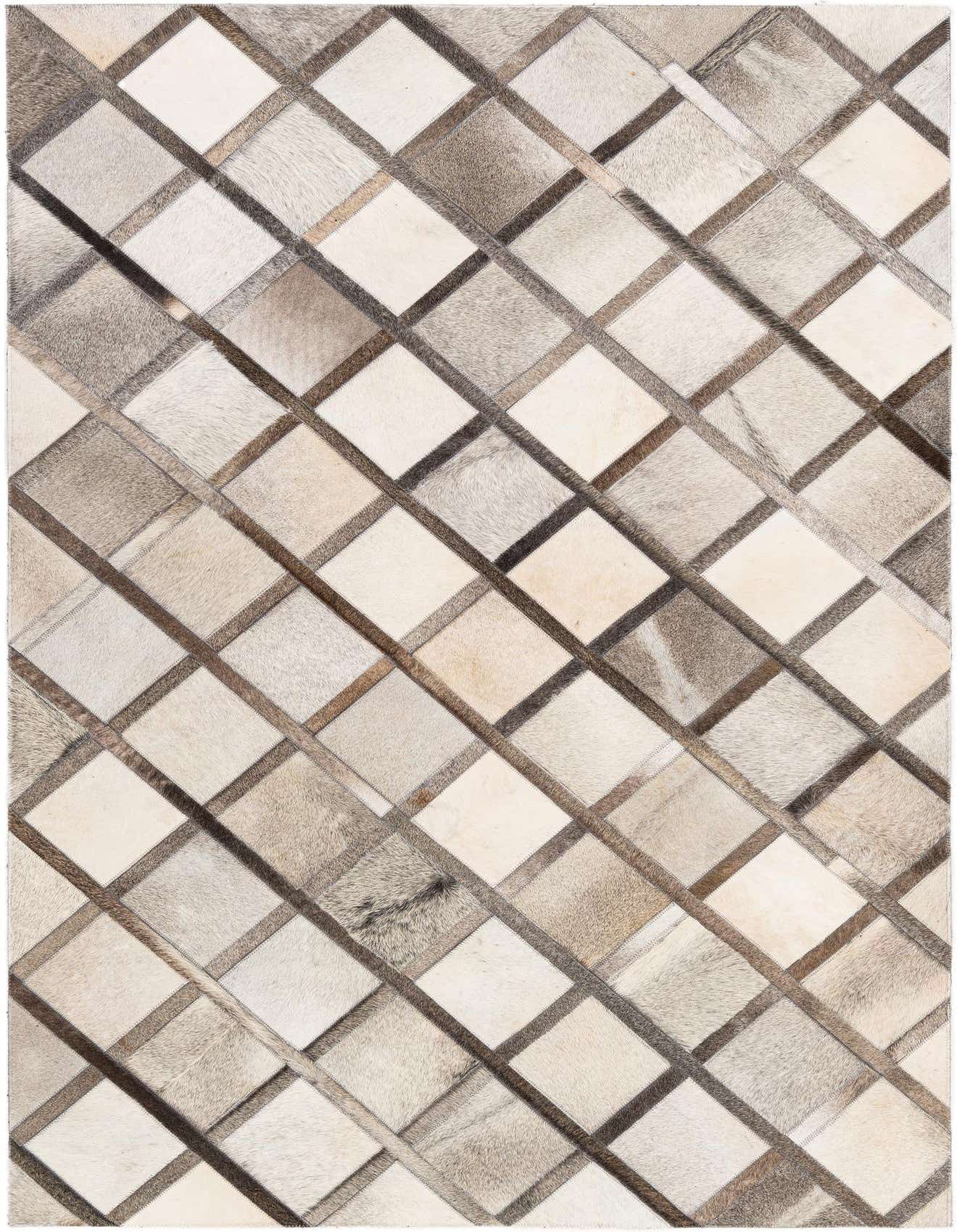 A rectangular 4x6 modern cowhide rug with a multi-colored diamond pattern in shades of brown, beige, and cream.