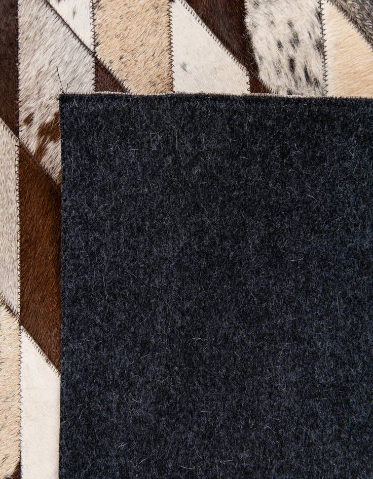 Detail image of  4' 1 x 5' 10 Cowhide Stocks Rug