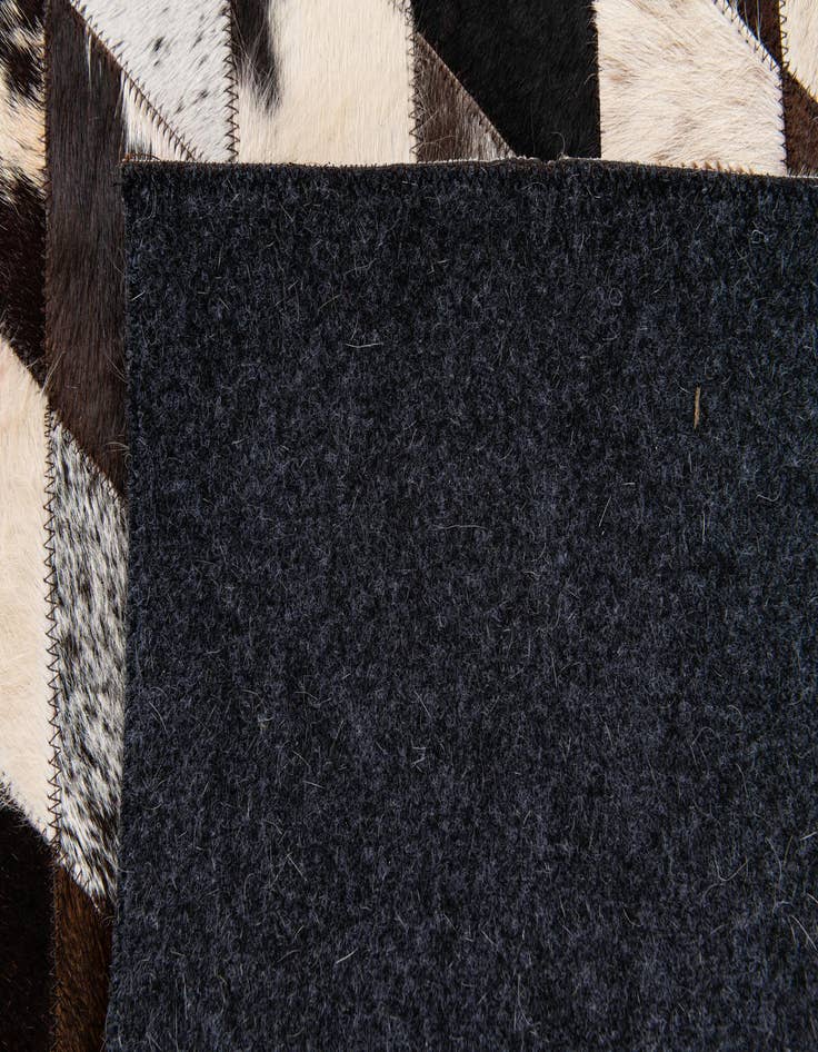 Detail image of  4' 1 x 5' 11 Cowhide Stocks Rug