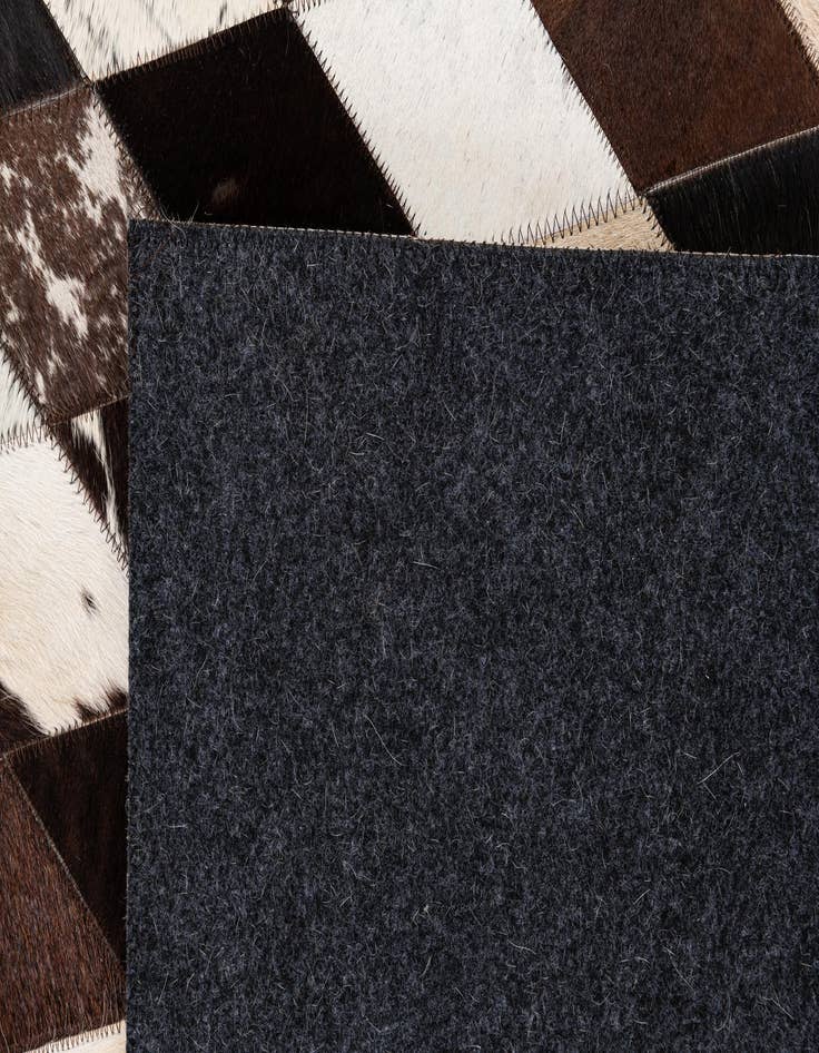 Detail image of  4' 1 x 5' 10 Cowhide Stocks Rug