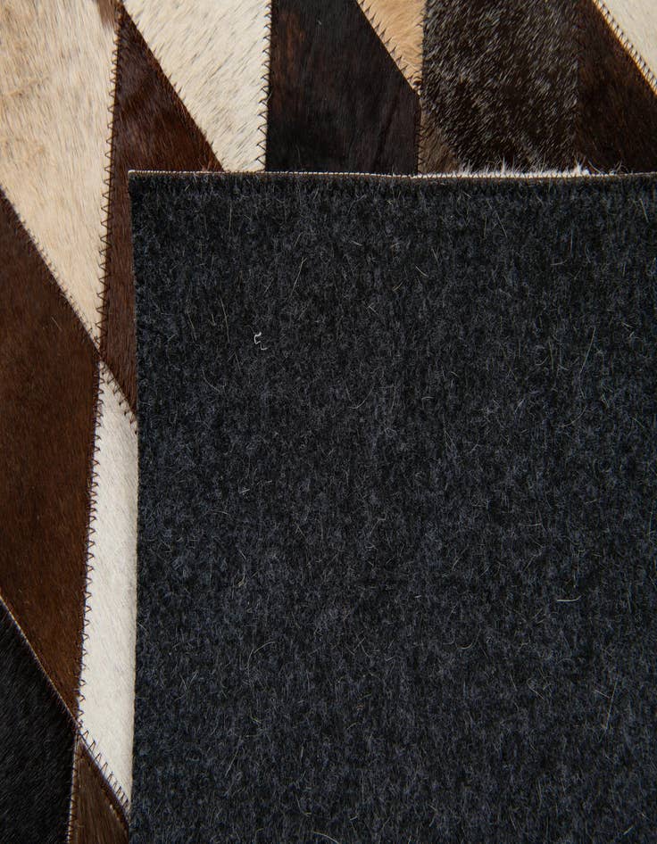 Detail image of  4' 1 x 5' 10 Cowhide Stocks Rug