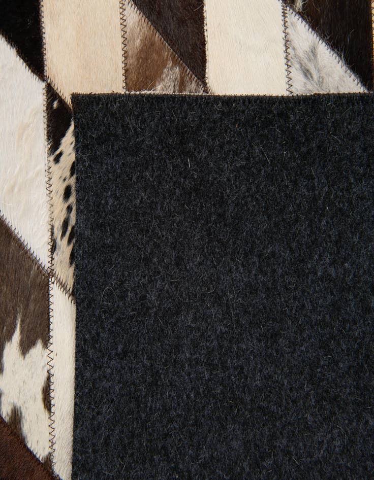 Detail image of  4' 1 x 5' 10 Cowhide Stocks Rug
