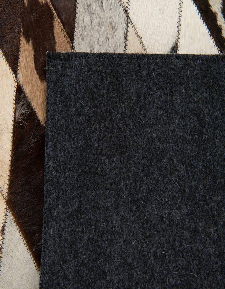 Detail image of  4' 1 x 5' 10 Cowhide Stocks Rug