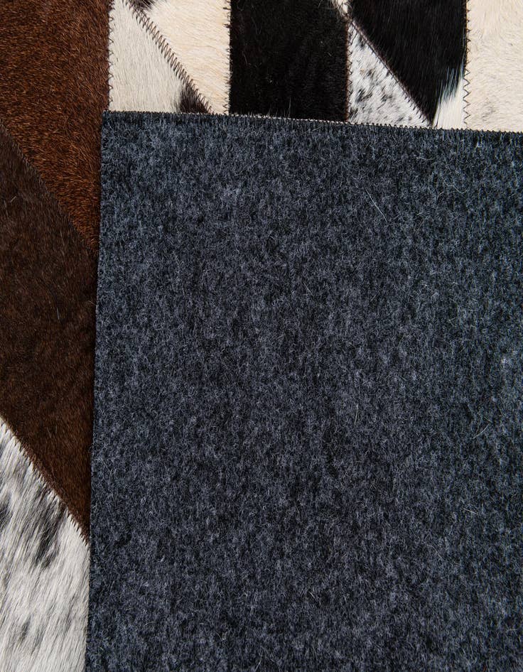 Detail image of  4' 1 x 5' 10 Cowhide Stocks Rug