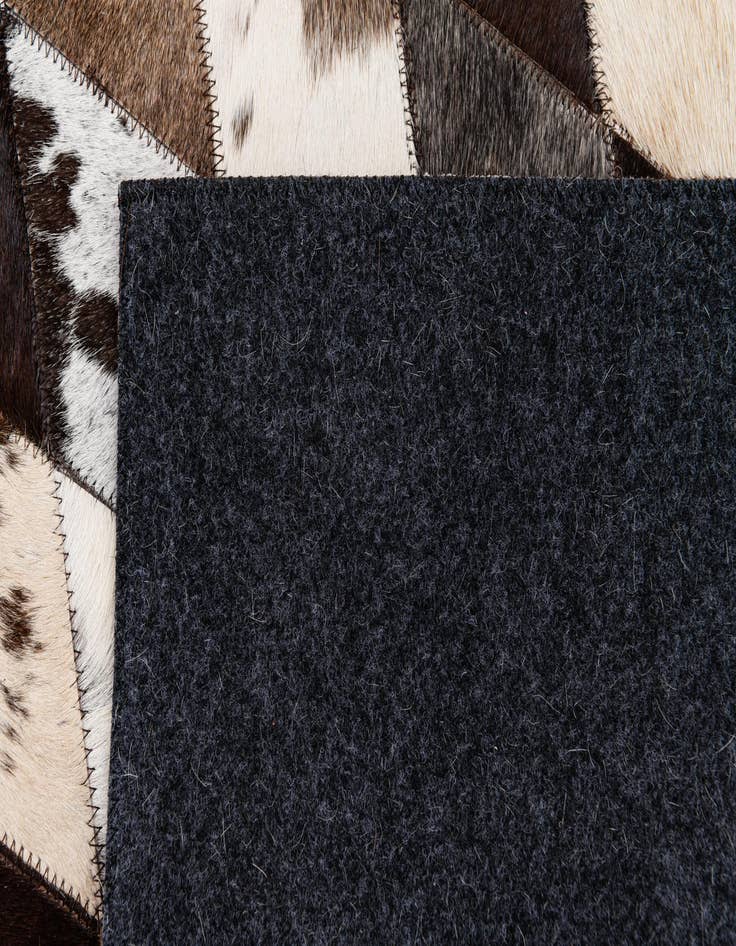 Detail image of  4' 1 x 5' 11 Cowhide Stocks Rug