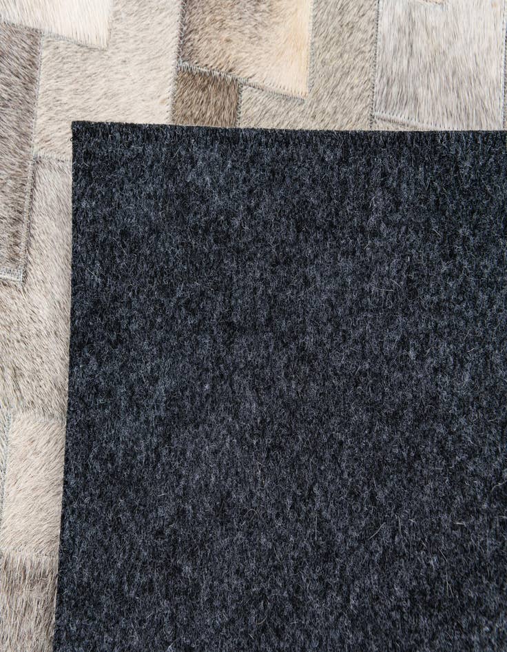 Detail image of  4' 1 x 5' 11 Cowhide Stocks Rug