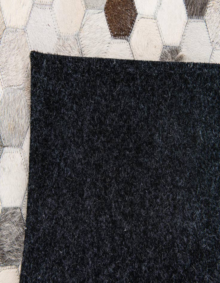 Detail image of  4' x 5' 11 Cowhide Stocks Rug