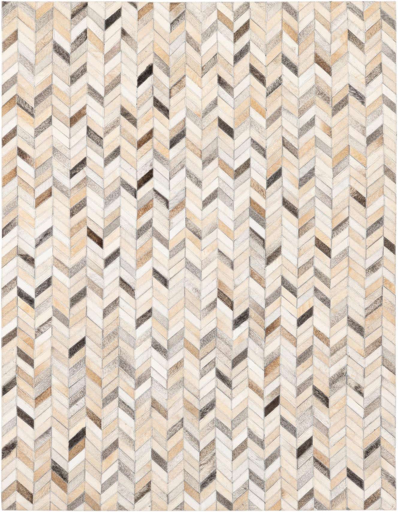 A rectangular 4x6 multi-colored cowhide rug featuring a modern chevron pattern in shades of brown, beige, and cream.