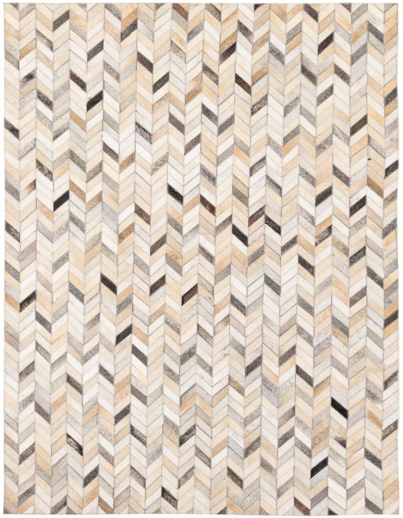 A 5x8 rectangular Cowhide Stocks rug from Rugs.com featuring a modern multi-colored chevron pattern in natural hide tones.