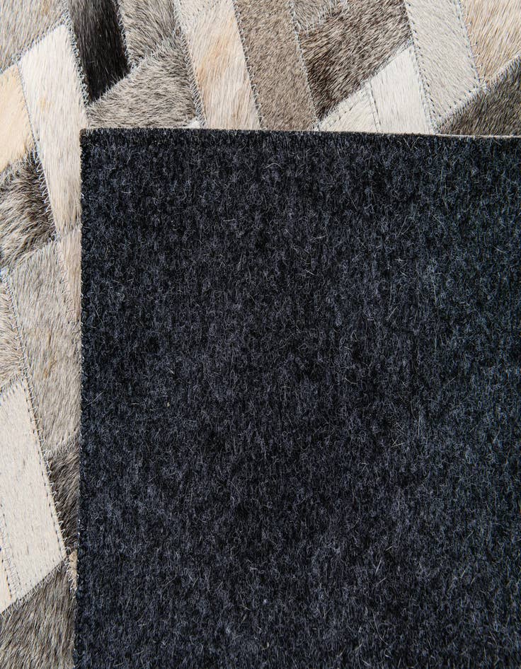 Detail image of  4' 1 x 5' 10 Cowhide Stocks Rug