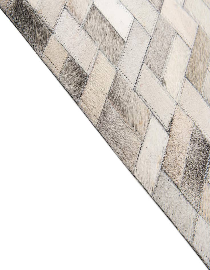 Detail image of  6' 8 x 9' 10 Cowhide Stocks Rug