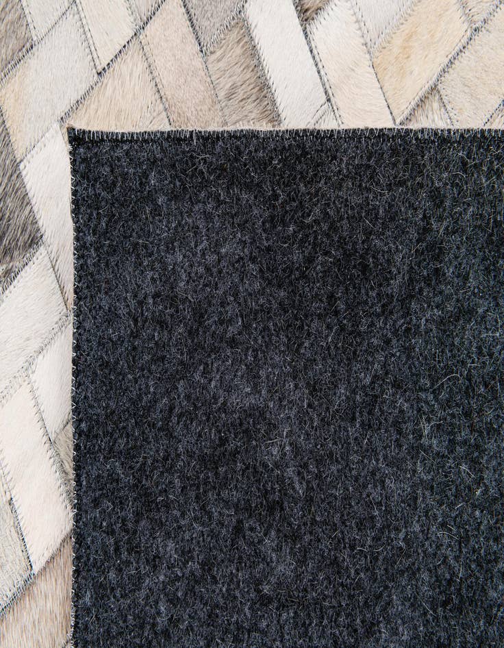 Detail image of  6' 8 x 9' 10 Cowhide Stocks Rug