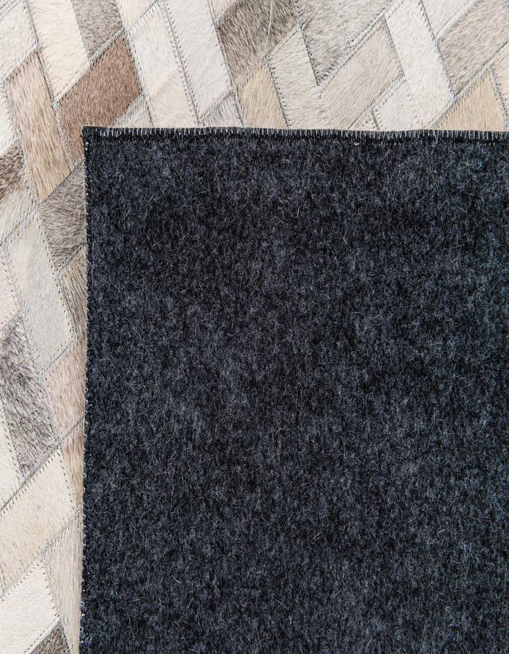 Detail image of  6' 7 x 9' 9 Cowhide Stocks Rug