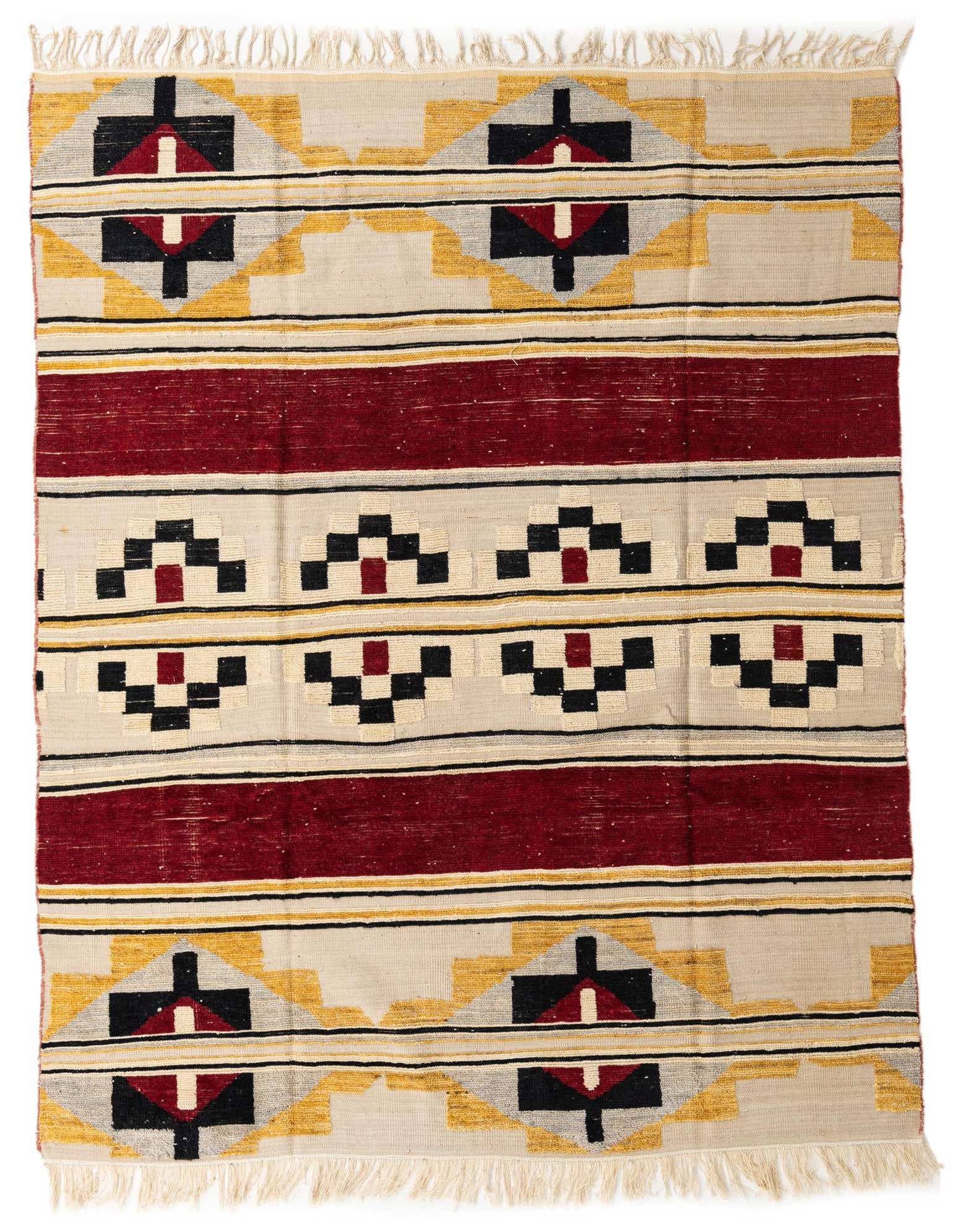 A rectangular 8x10 wool rug featuring a modern abstract pattern in multi-colors, including red, black, gold, and cream, with fringe.